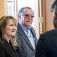 Three individuals speaking